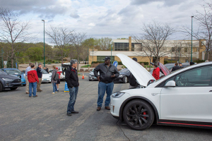 Gentleman looking at electric vehicles